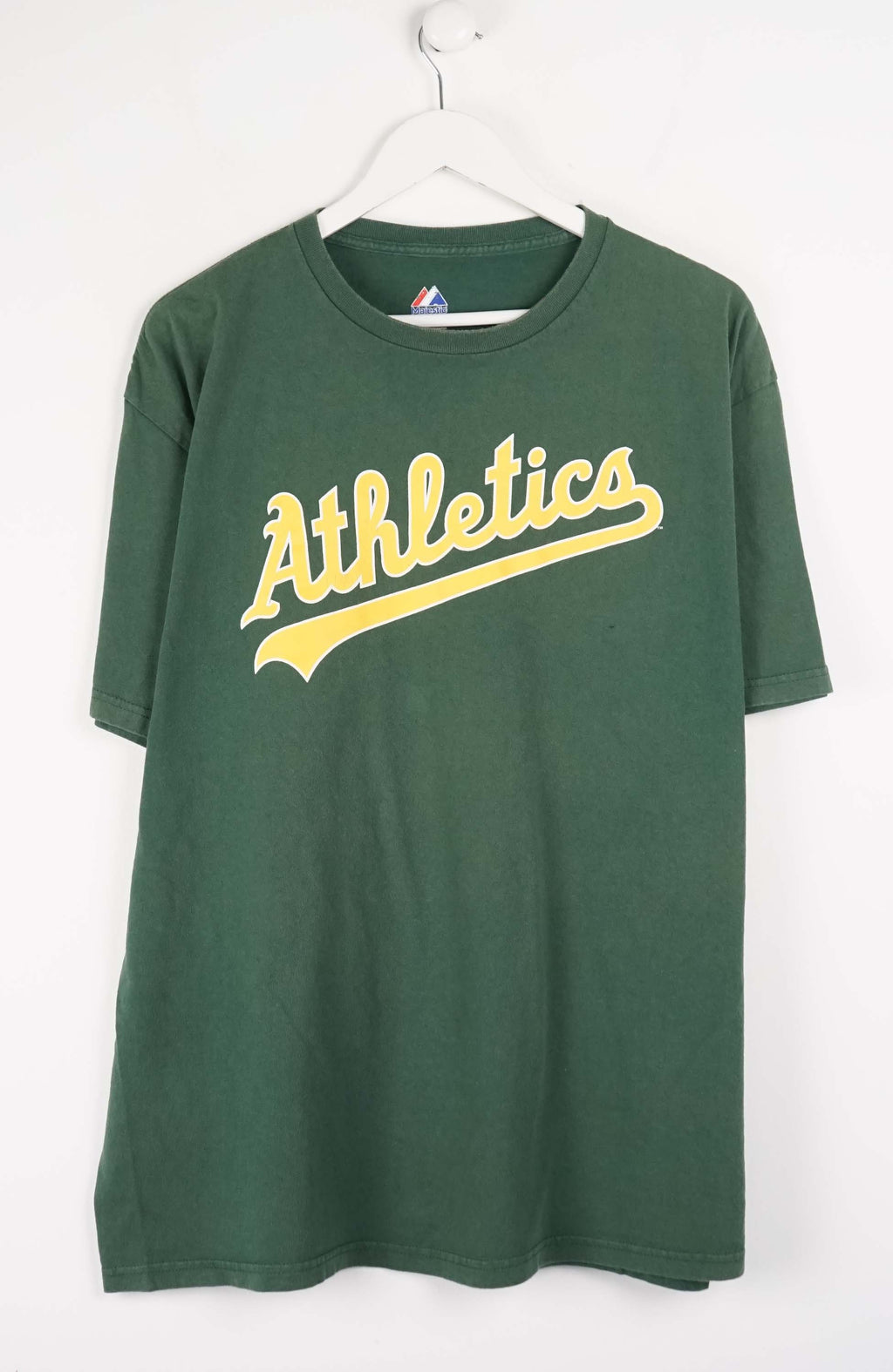 Green t-shirt with 'Athletics' text on a white background
