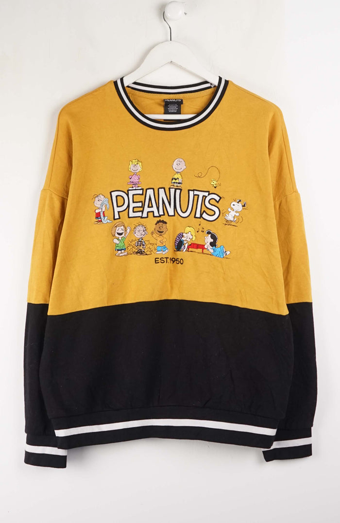 Yellow and black sweatshirt with Peanuts character design on a white background