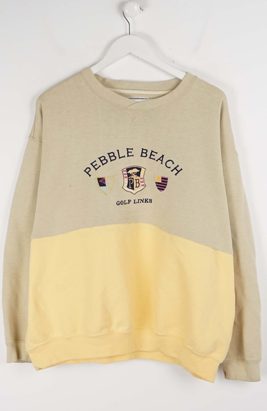 Beige and yellow sweatshirt with 'Pebble Beach Golf Links' text on a white background