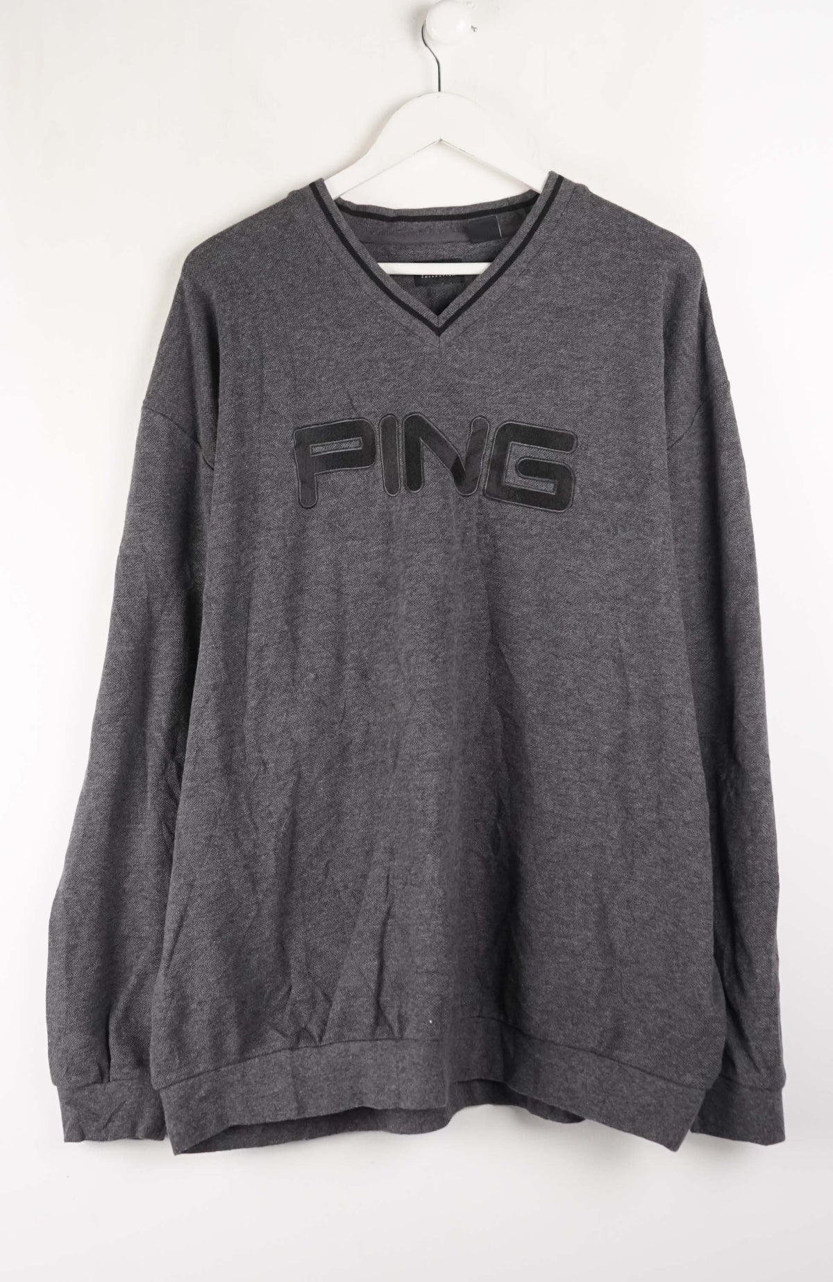Gray sweatshirt with 'PING' logo on a white background