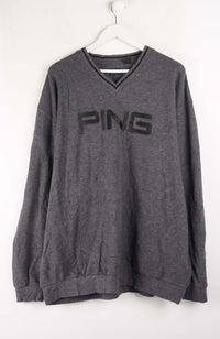Gray sweatshirt with 'PING' logo on a white background