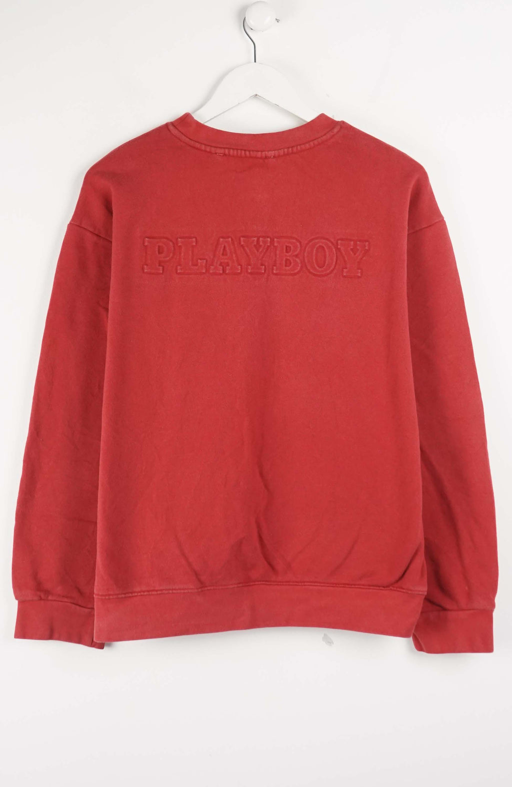 Red sweatshirt with a small logo on a white background