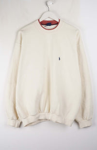 Beige sweatshirt with a small logo on a white background