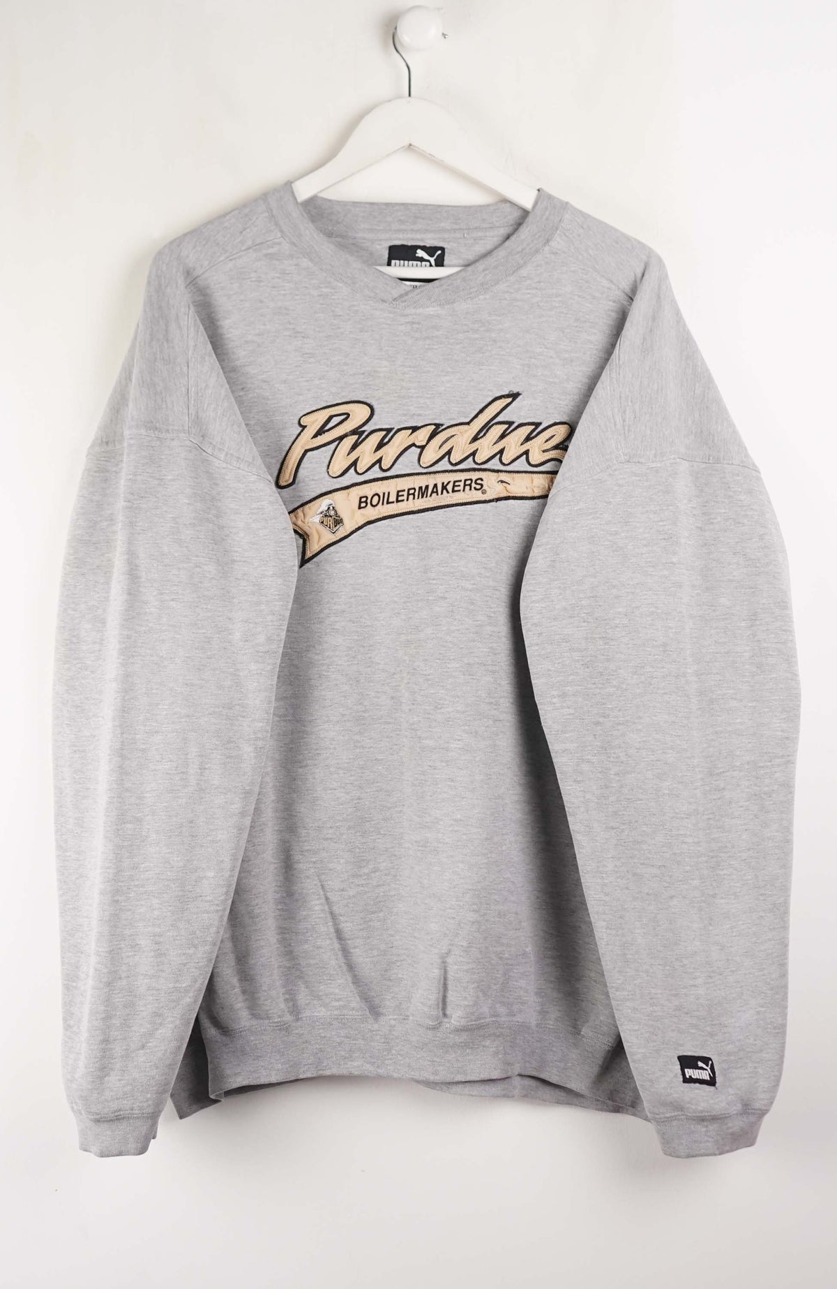 Gray sweatshirt with 'Purdue Boilermakers' text on a white background