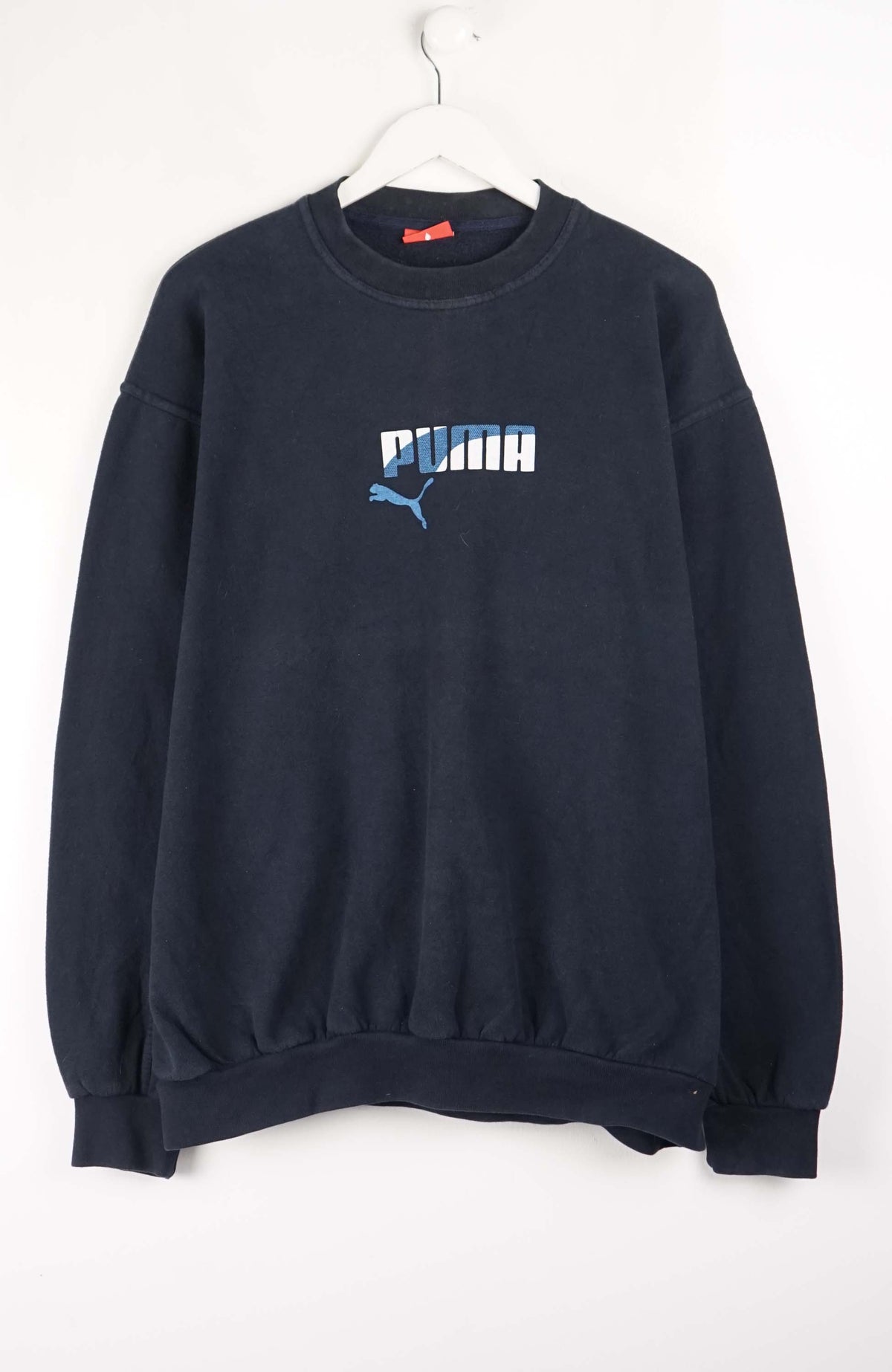 Navy blue Puma sweatshirt on a white background