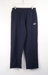 Navy blue pants with a brand logo on a white background