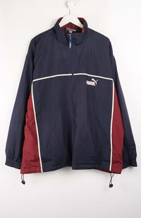 Navy and red jacket with Puma logo on a white background