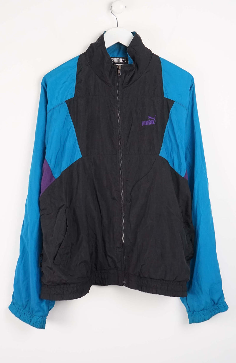 Blue and black jacket with a brand logo on a white background