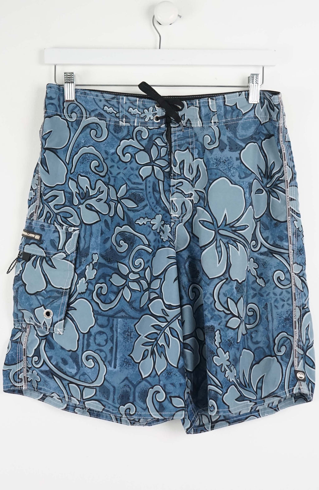 Blue floral-patterned shorts on a white hanger