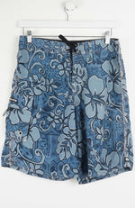 Blue floral-patterned shorts on a white hanger