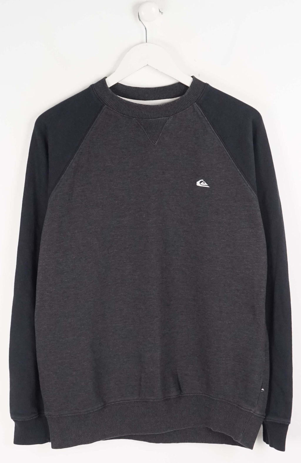 Gray sweatshirt with a small logo on a white background