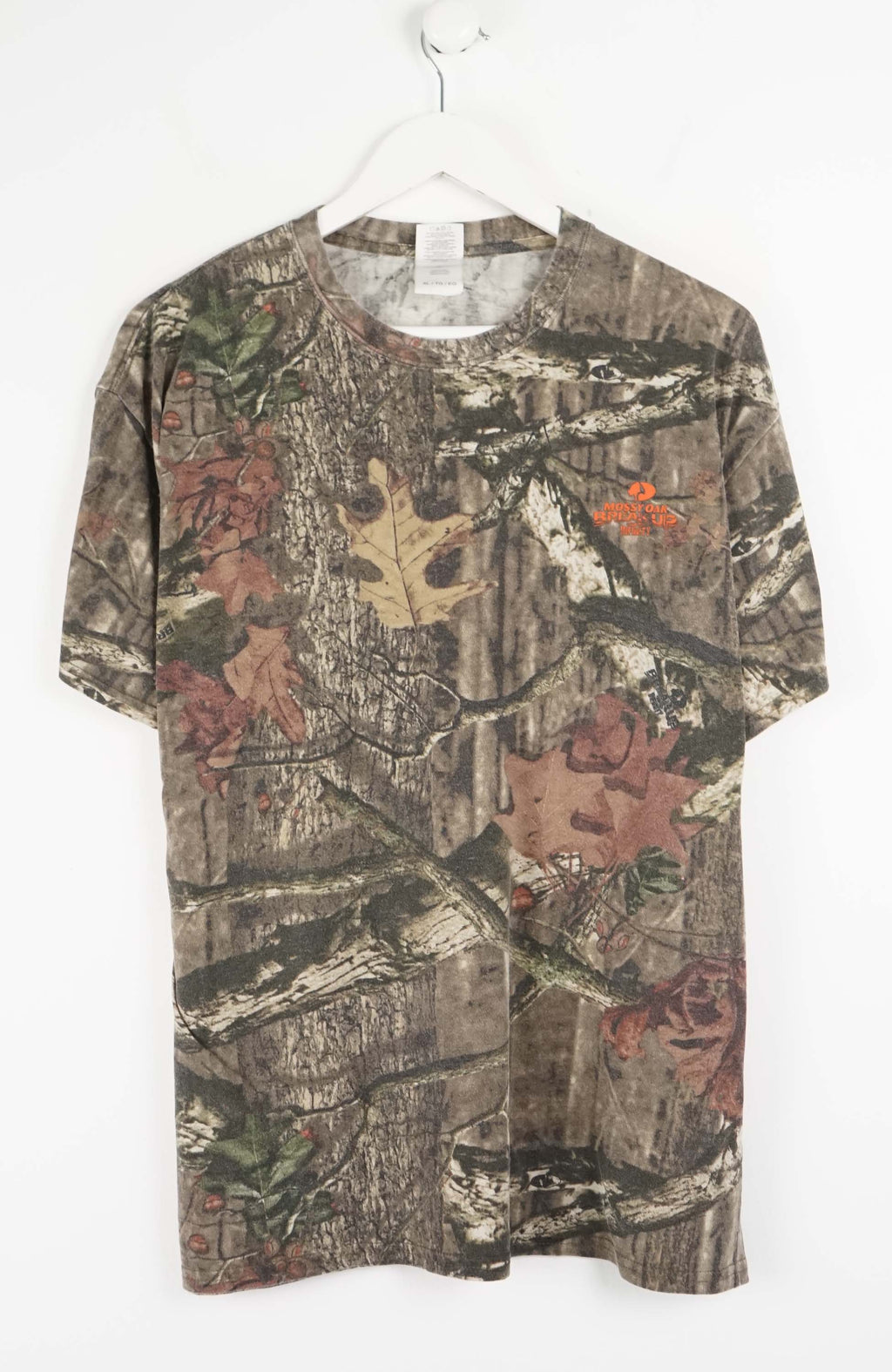 Camouflage-patterned t-shirt on a white background