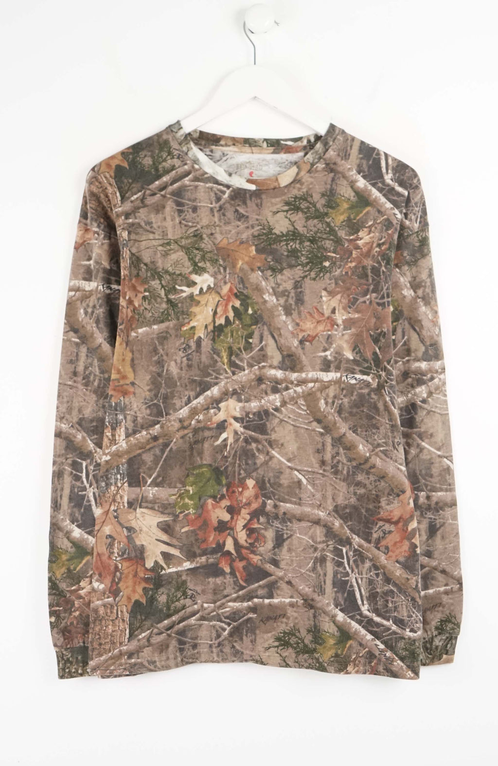 Camouflage-patterned long-sleeve shirt on a white background