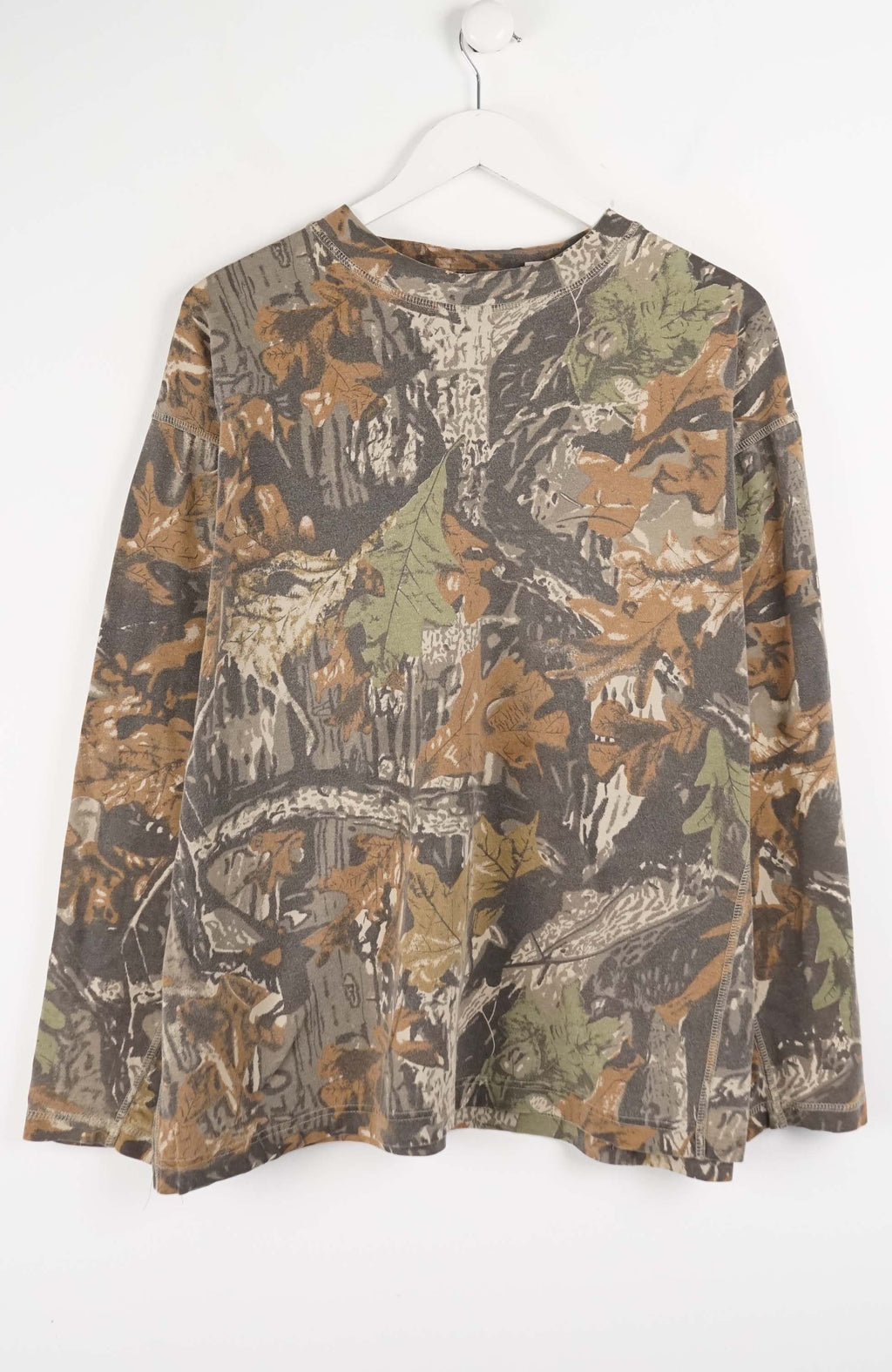 Camouflage-patterned shirt on a white background