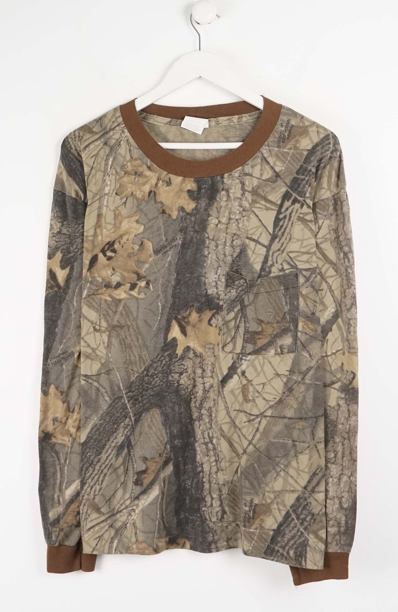 Camouflage-patterned long-sleeve shirt on a white hanger