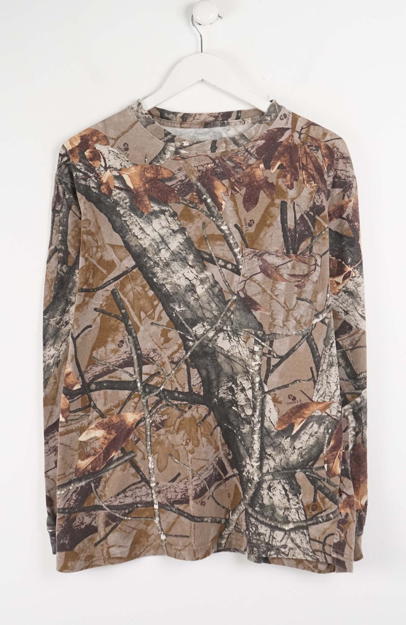 Camouflage-patterned long-sleeve shirt on a white hanger