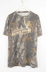 Camouflage-patterned t-shirt with Cabela's branding on a white background