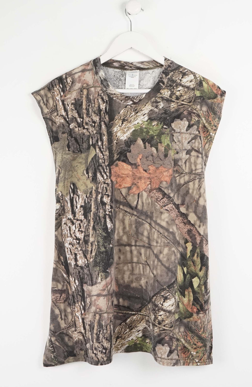 Camouflage sleeveless shirt on a white hanger