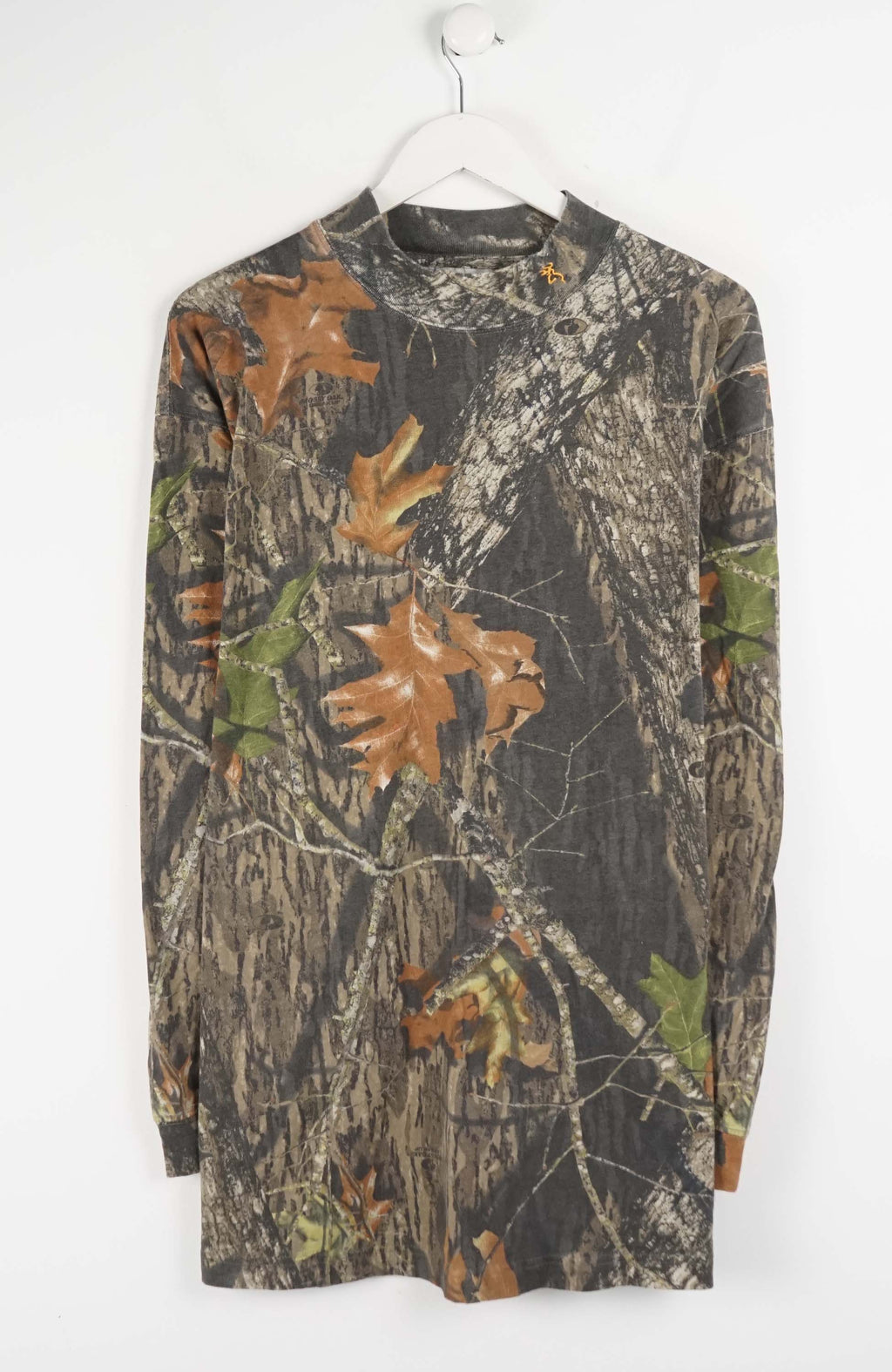 Camouflage-patterned long-sleeve shirt on a white hanger