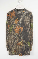 Camouflage-patterned long-sleeve shirt on a white hanger