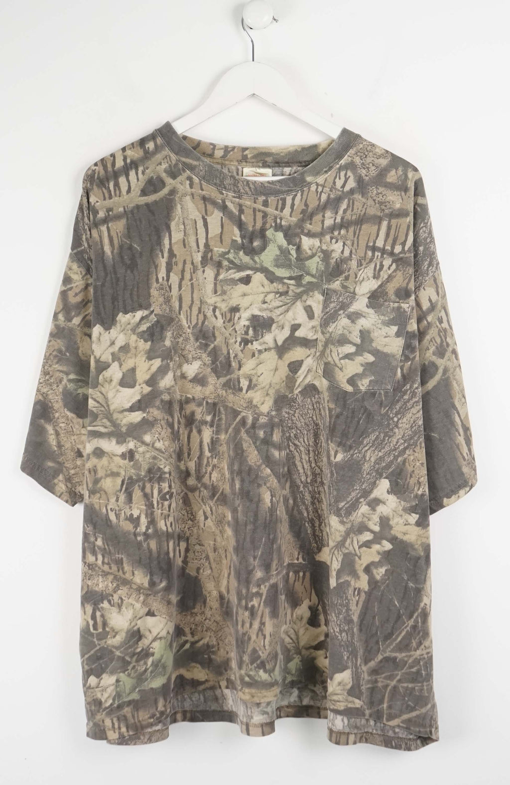 Camouflage-patterned shirt on a white hanger