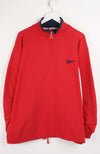 Red long-sleeve shirt with a logo on a white background