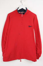 Red long-sleeve shirt with a logo on a white background