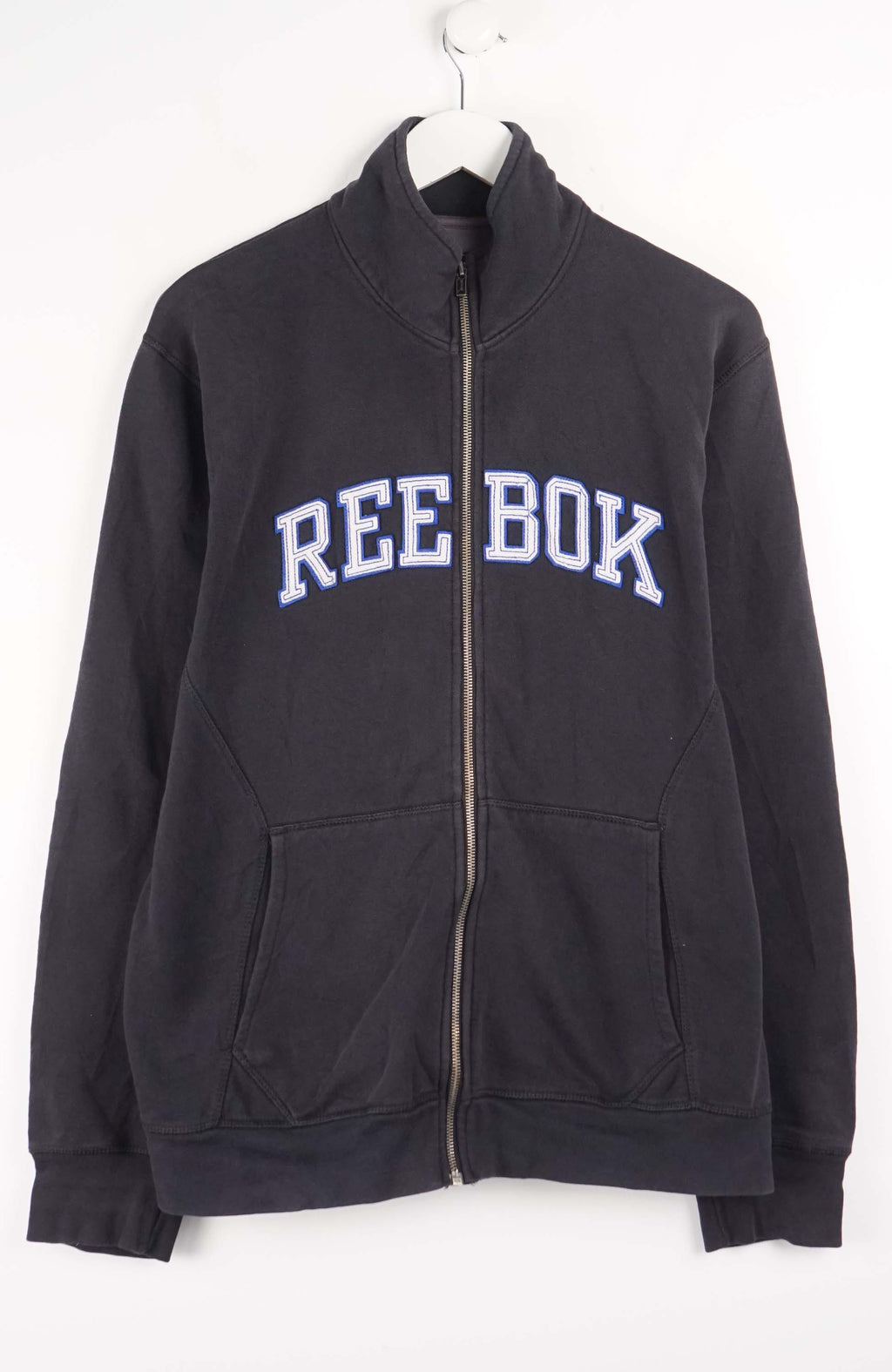 Black Reebok jacket with white text on a white background