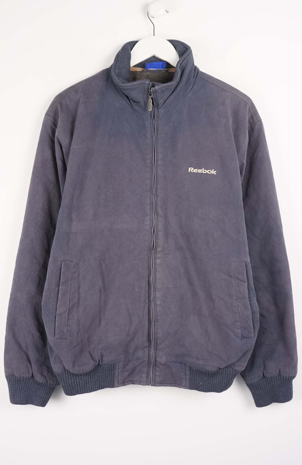 Gray Reebok jacket on a white background