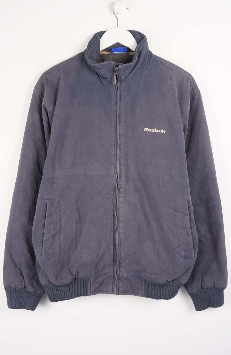 Gray Reebok jacket on a white background