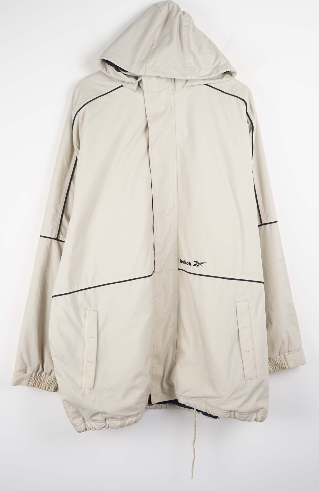 Beige winter coat with black accents on a white background