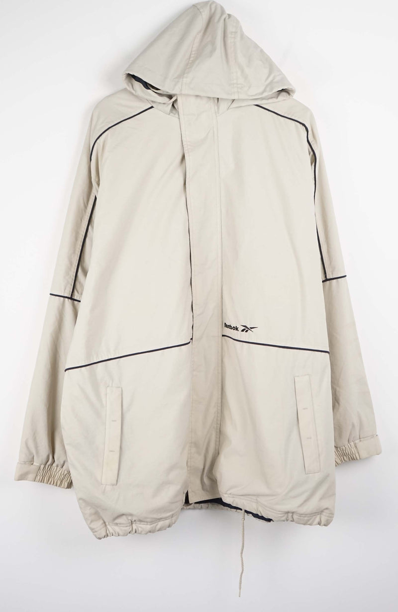 Beige winter coat with black accents on a white background