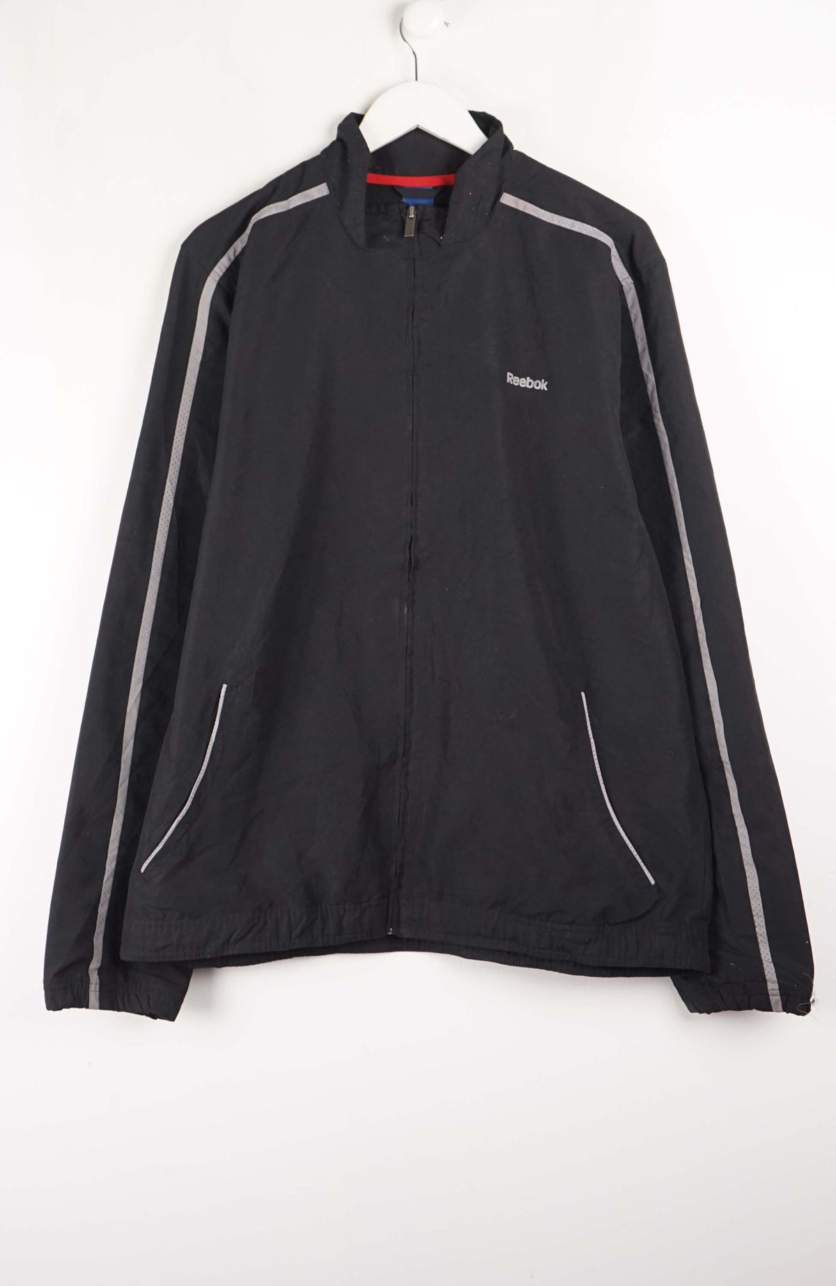 Black jacket with gray accents on a white hanger