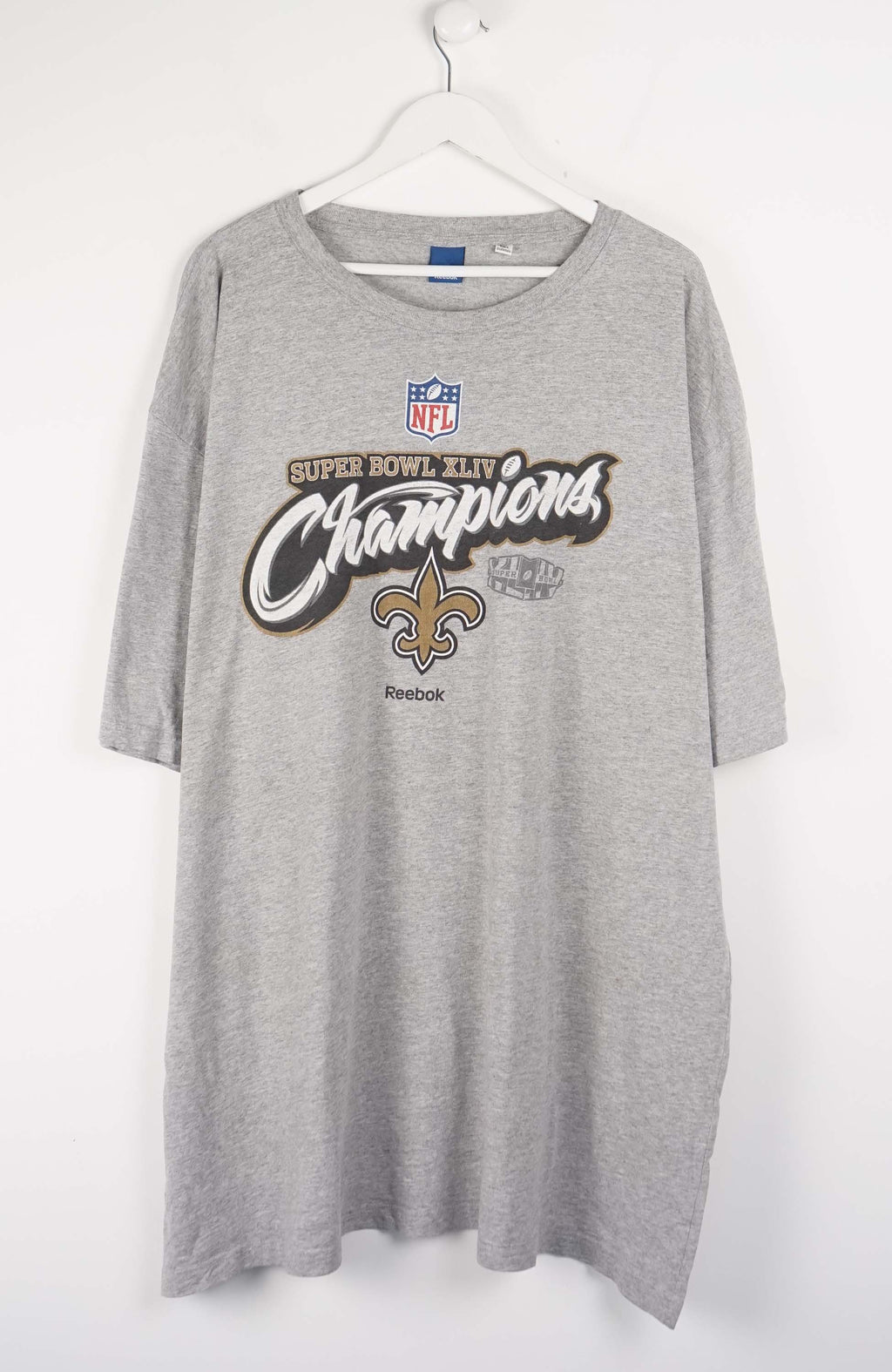 Gray t-shirt with Super Bowl Champions text and logo on a white background