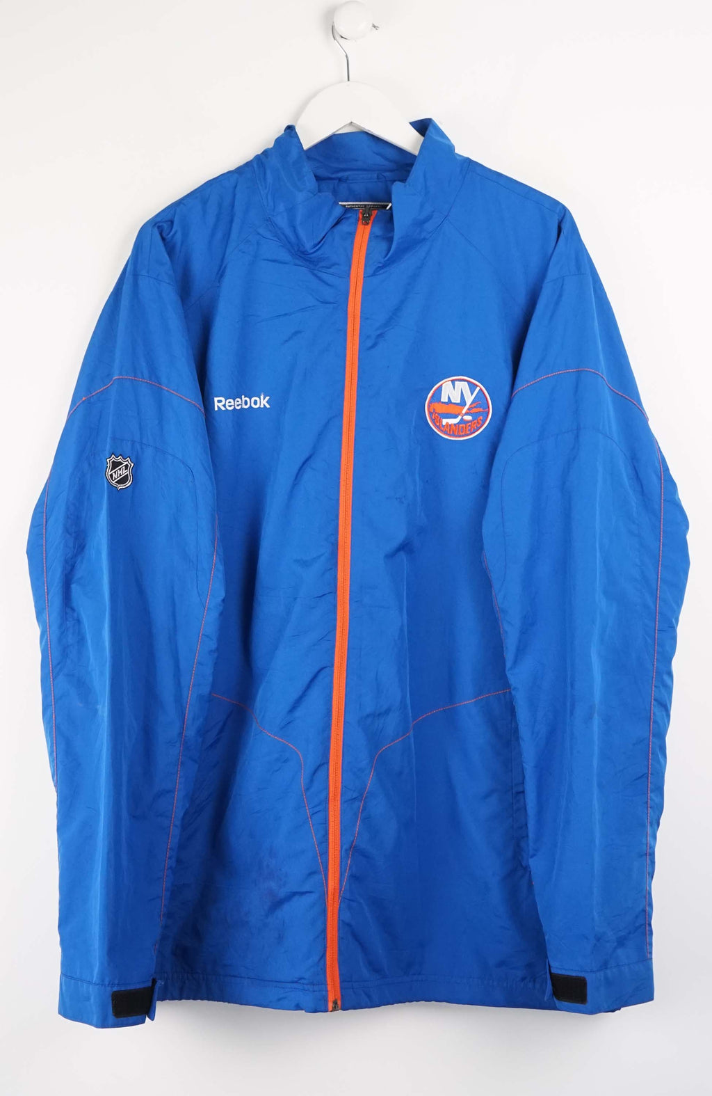 Blue jacket with Reebok logo on a white background