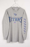 Gray long-sleeve shirt with Tennessee Titans logo on a white background