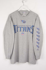 Gray long-sleeve shirt with Tennessee Titans logo on a white background