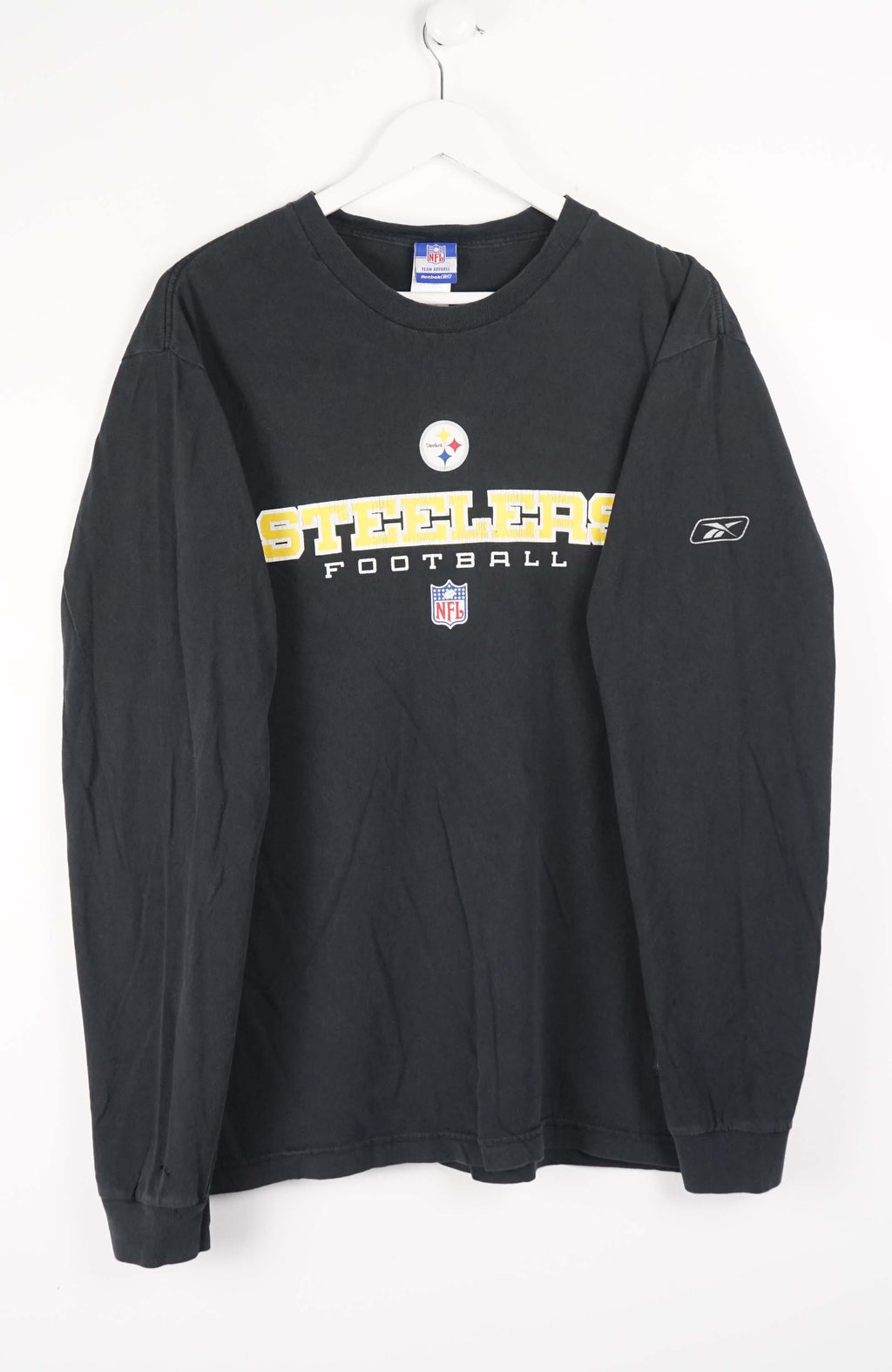 Black long-sleeve shirt with 'Steelers' and Reebok logos on a white background