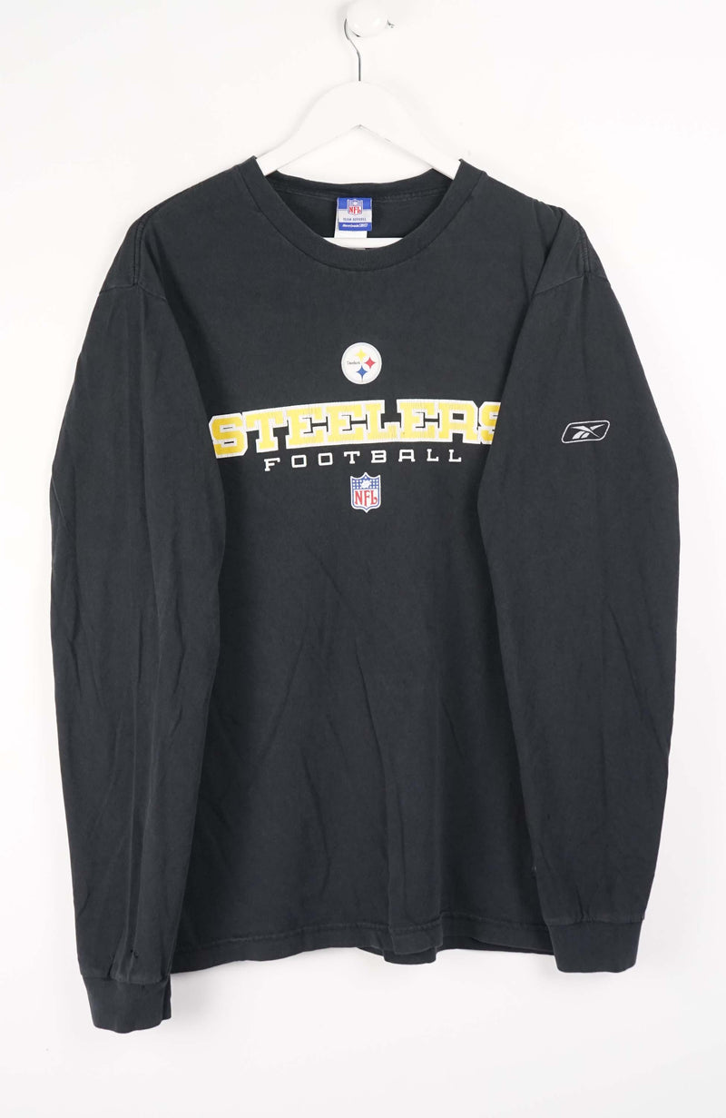 Black long-sleeve shirt with 'Steelers' and Reebok logos on a white background
