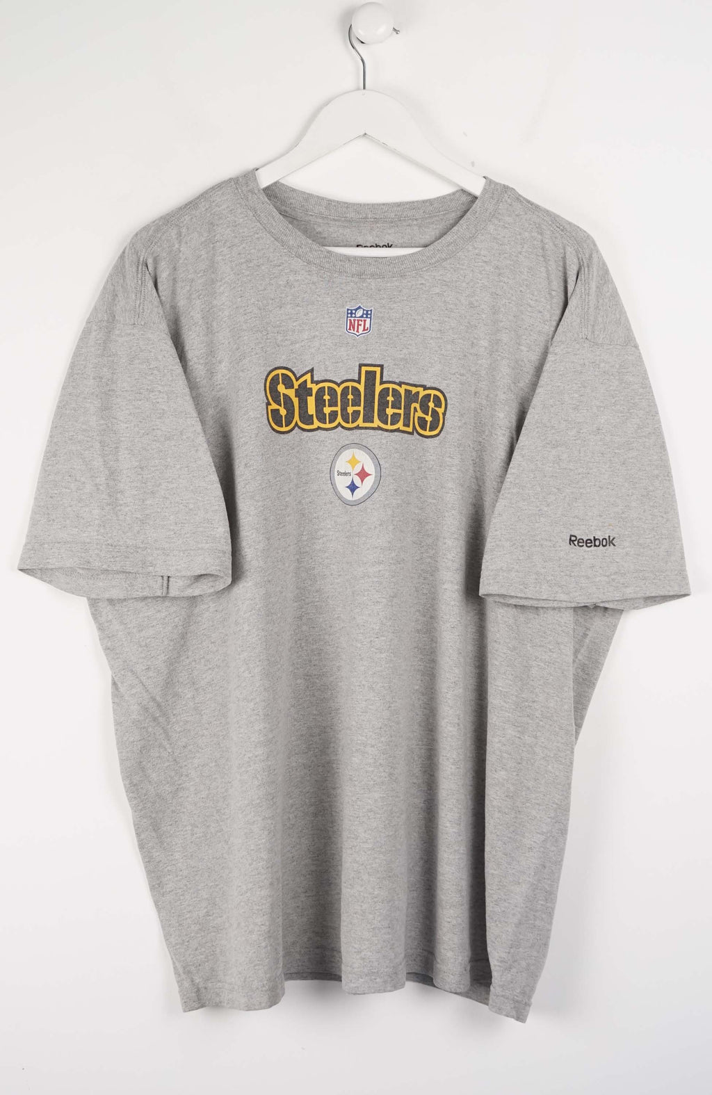 Gray t-shirt with Steelers logo on a white hanger