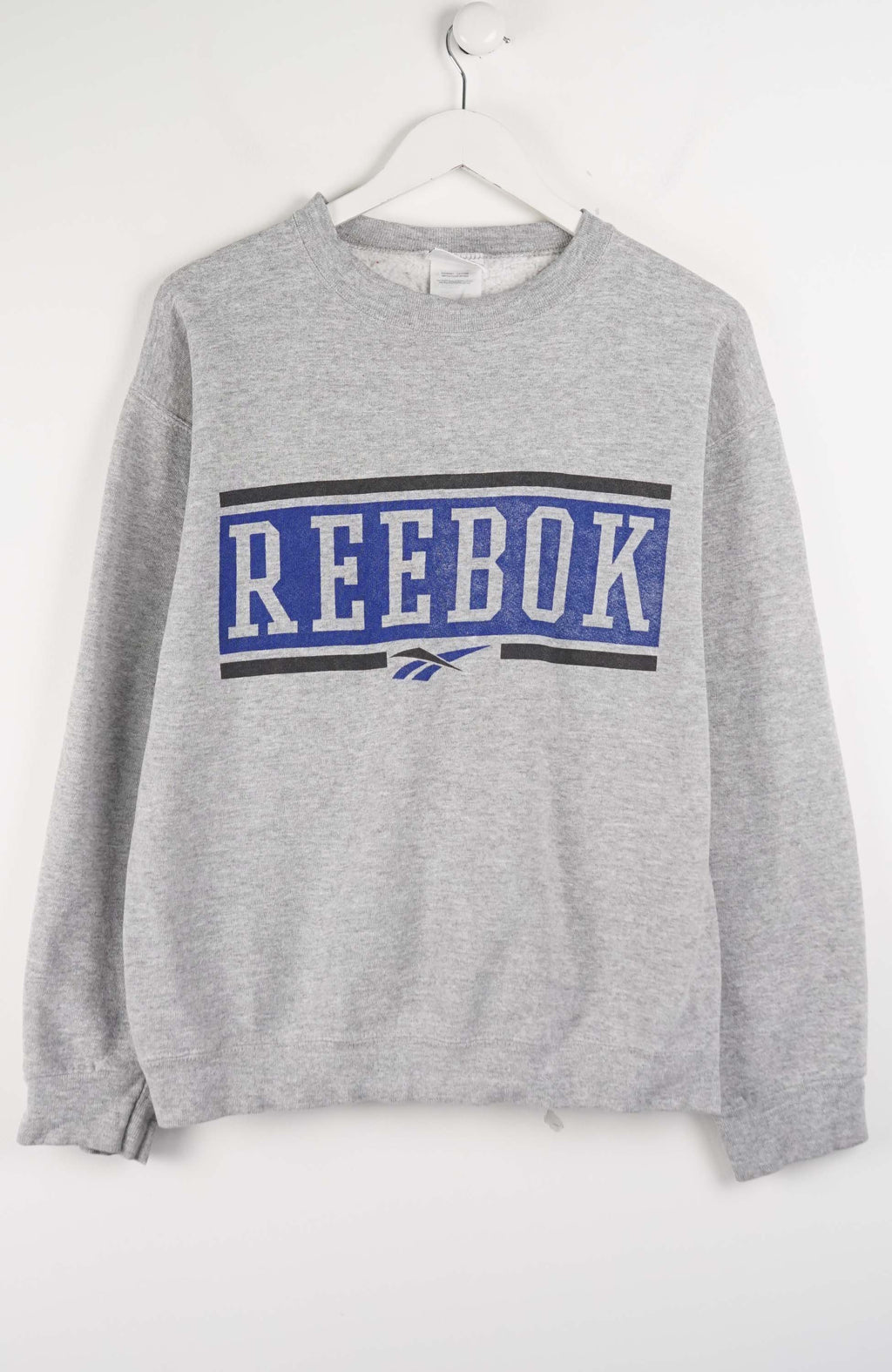 Gray Reebok sweatshirt on a white hanger