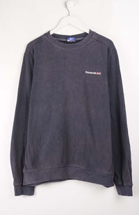Dark gray sweatshirt with a small logo on a white background