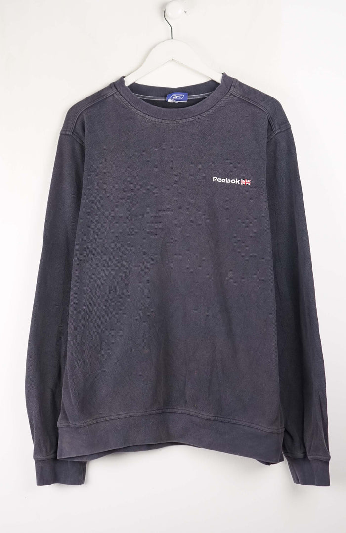 Dark gray sweatshirt with a small logo on a white background