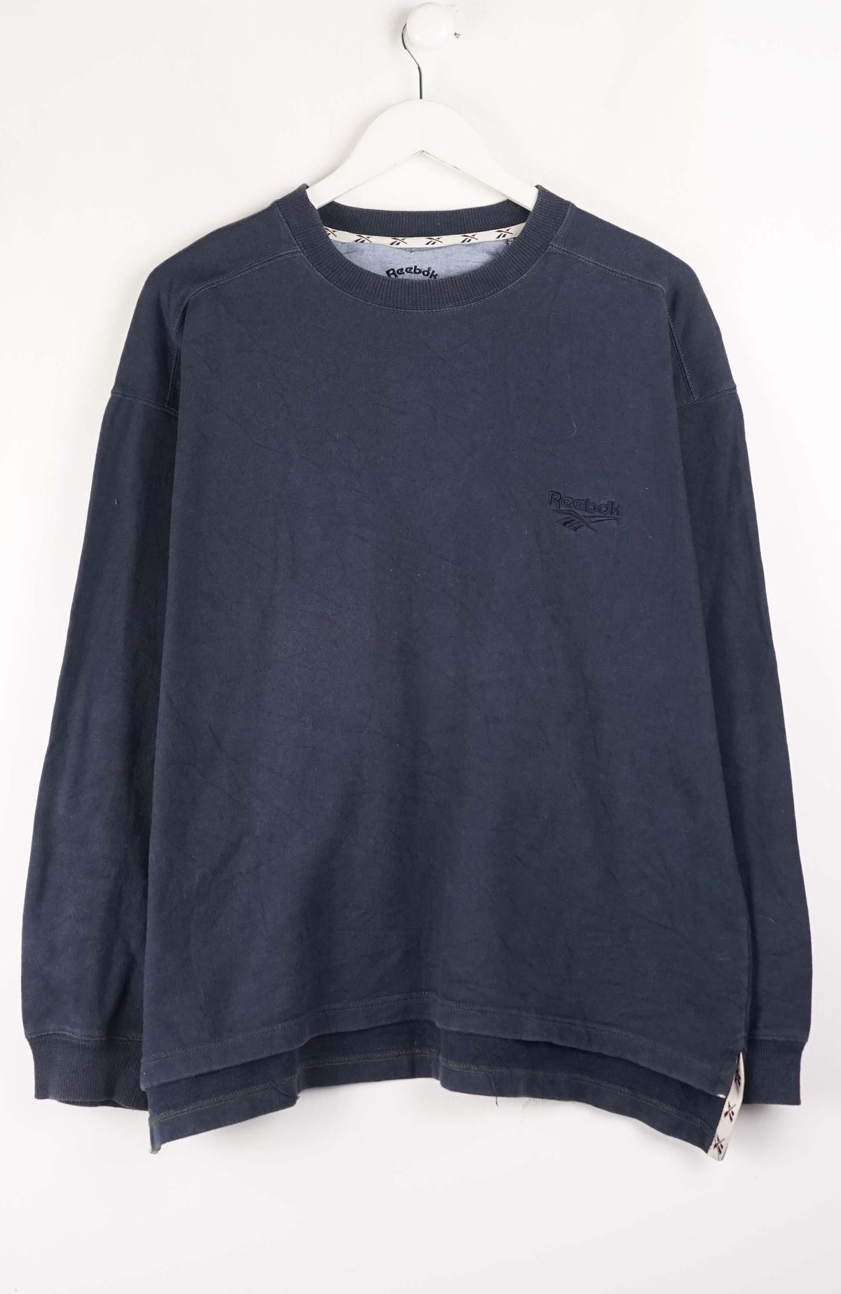 Navy blue sweatshirt with a brand logo on a white background