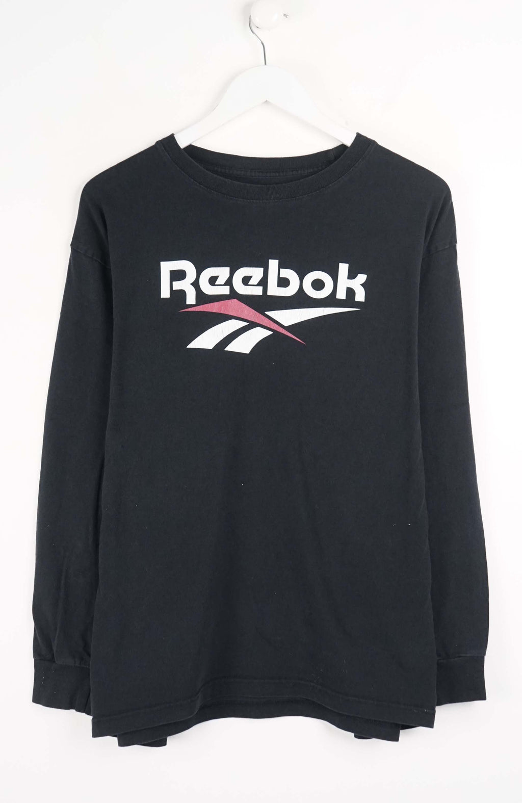 Black Reebok sweatshirt on a white hanger against a white background