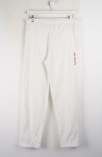 White pants with a red logo on a white background