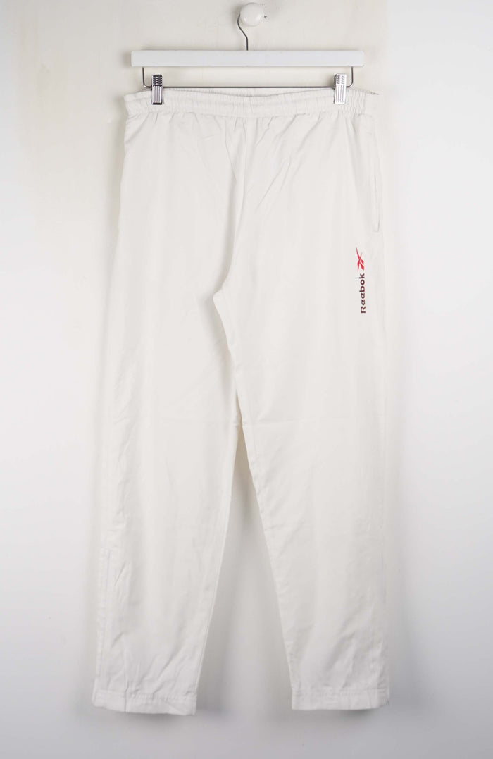 White pants with a red logo on a white background