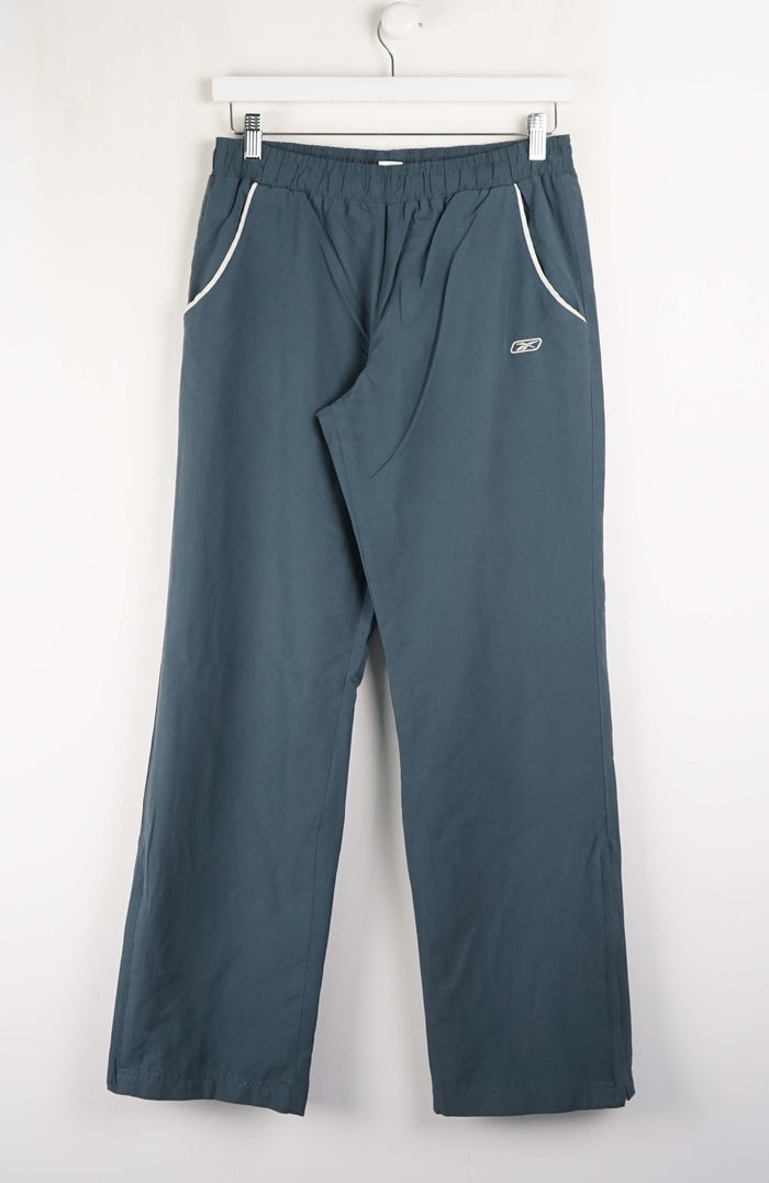 Blue pants with a brand logo on a white background