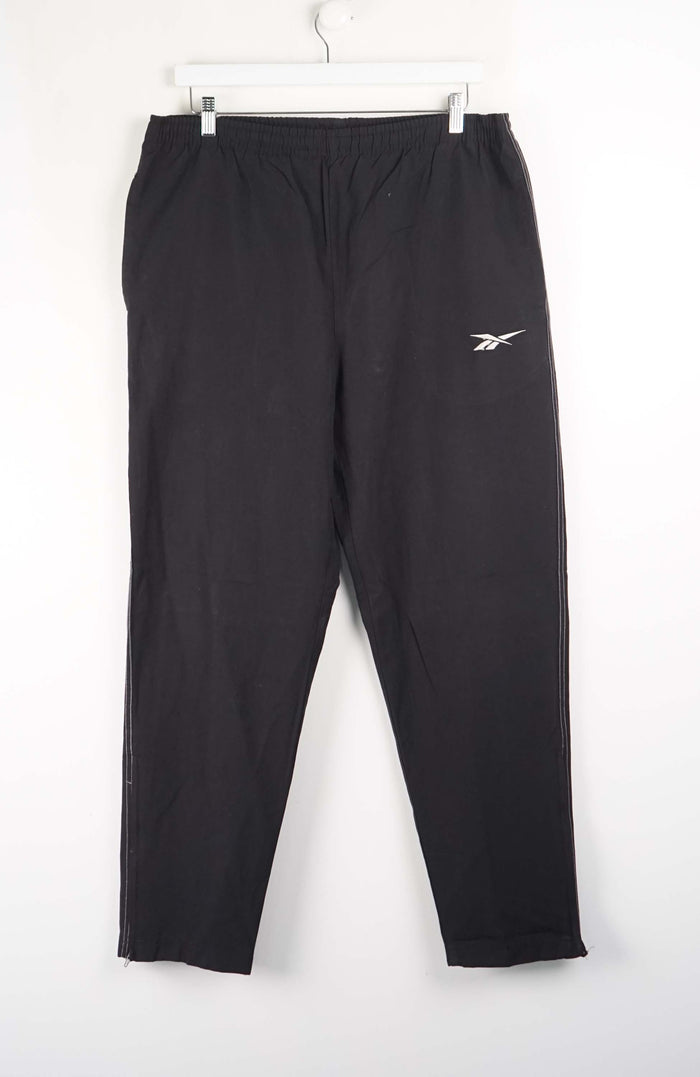 Black sweatpants with a logo on a white background
