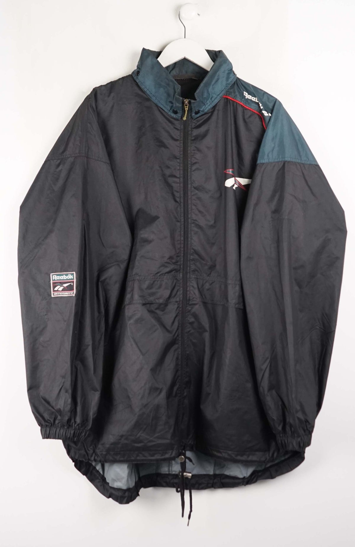 Black jacket with teal accents on a white hanger